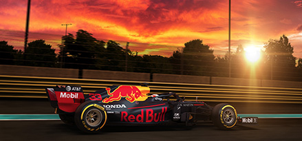 Monoplaza de la escudería Red Bull Racing corriendo en puesta de sol